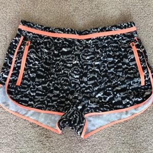 Black and grey Fabletics activewear shorts